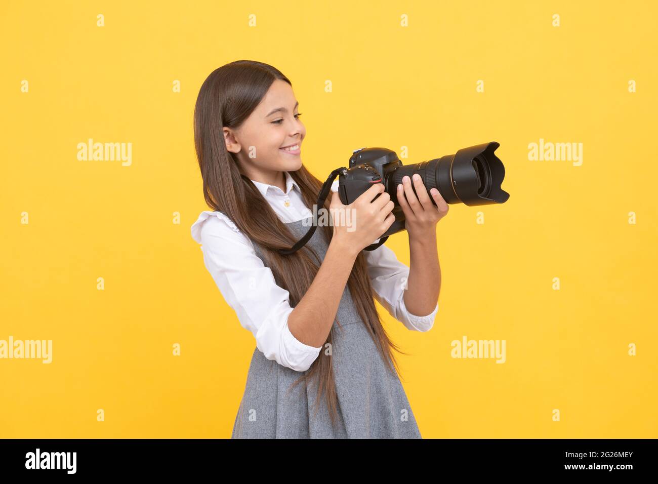 having skills. snapshot. childhood. teen girl taking photo. kid use digital camera. Stock Photo