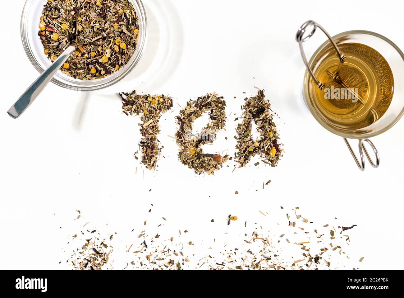 Tea text made by tea leaf on wwhite background surface with a bowl of ...