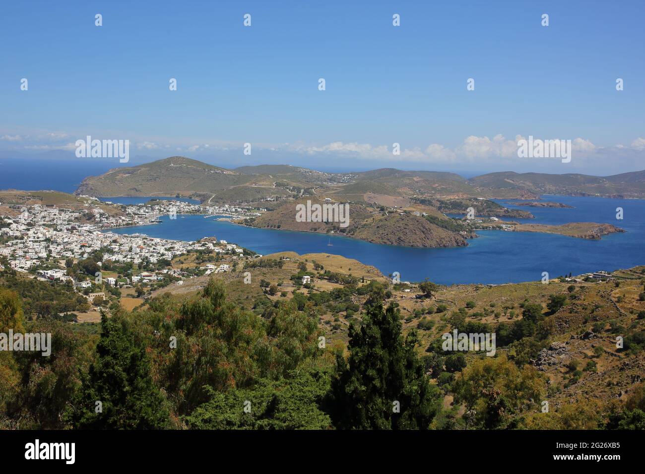 Aerial/Landscape view of Skala harbor and town, Patmos Island, Greece Stock Photo