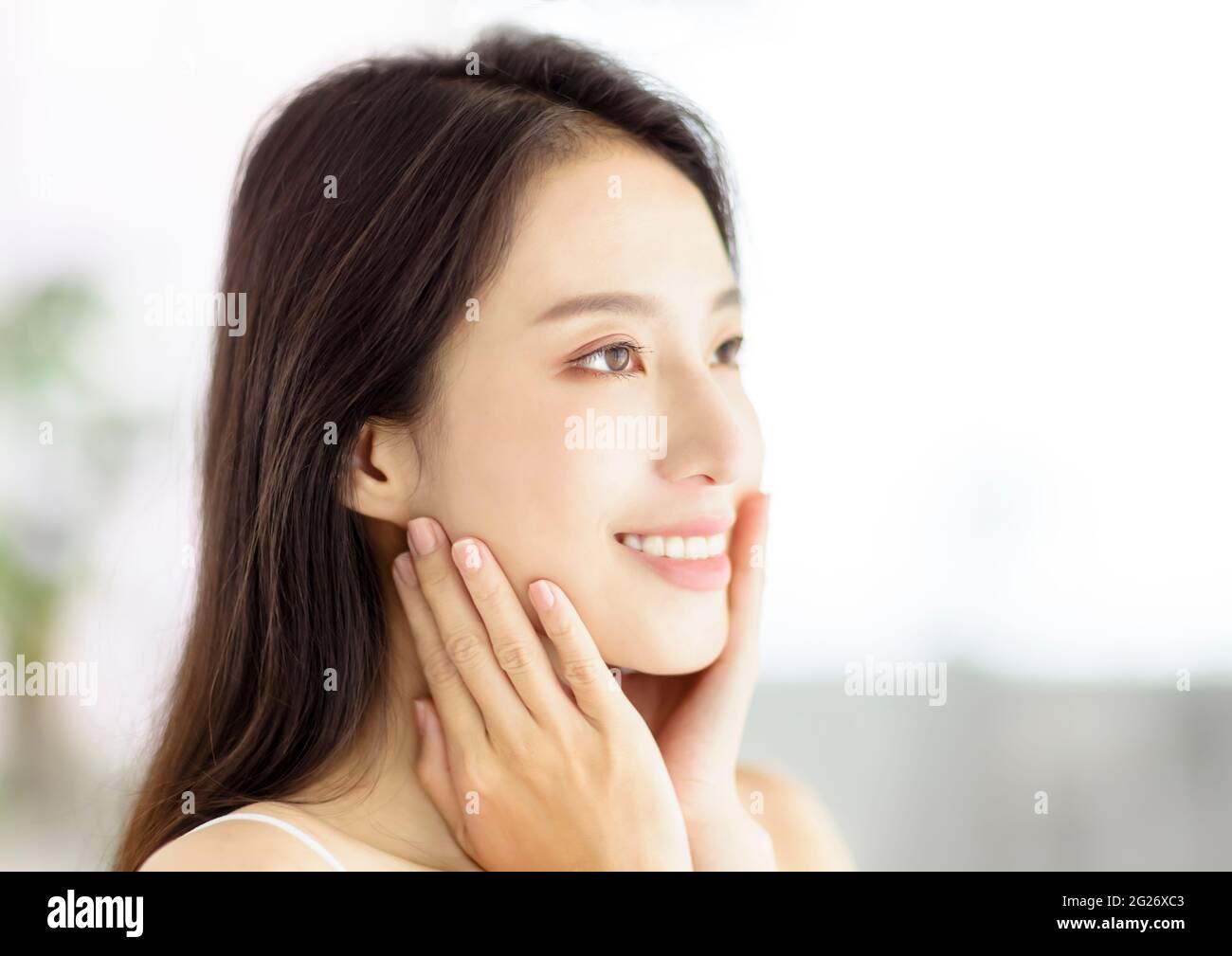 Smiling  beautiful pretty asian woman with clean fresh healthy skin Stock Photo