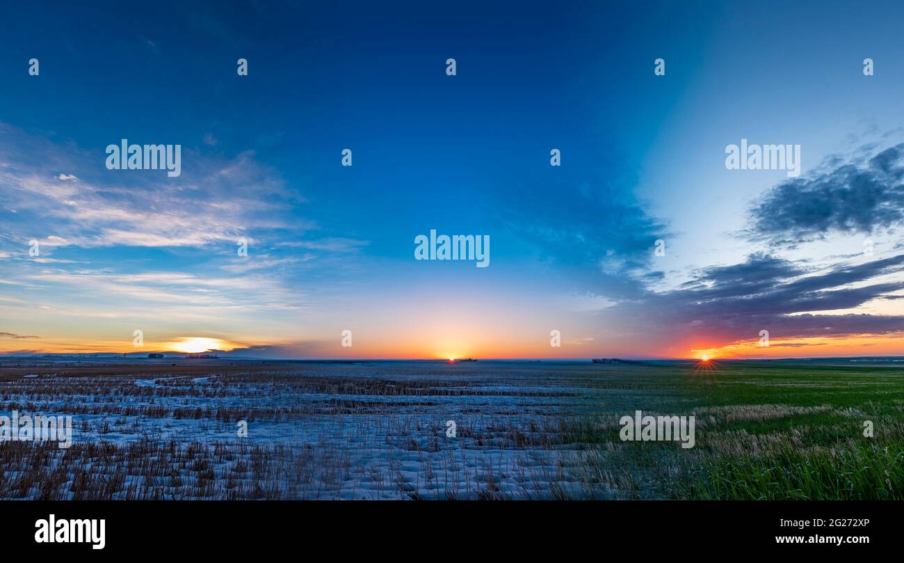 Composite showing the shifting sunset through the seasons, with summer solstice at right and winter solstice at left. Stock Photo
