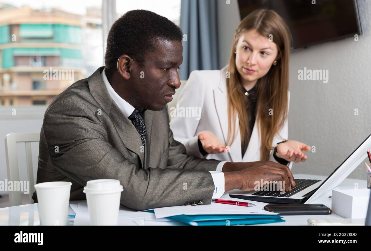 Focused coworkers working together Stock Photo