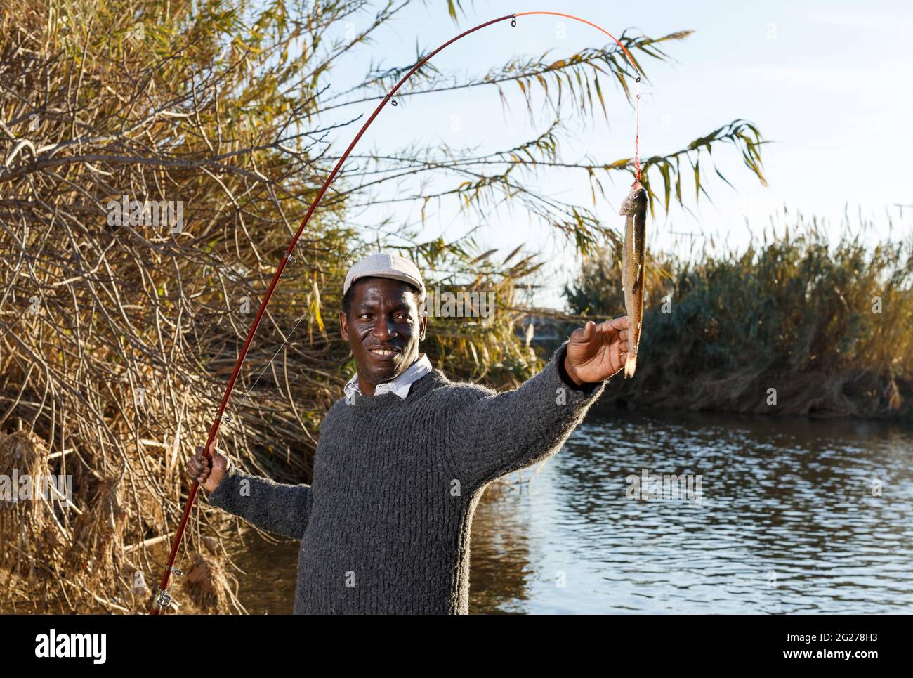 Portrait of enthusiastic African fisherman Stock Photo