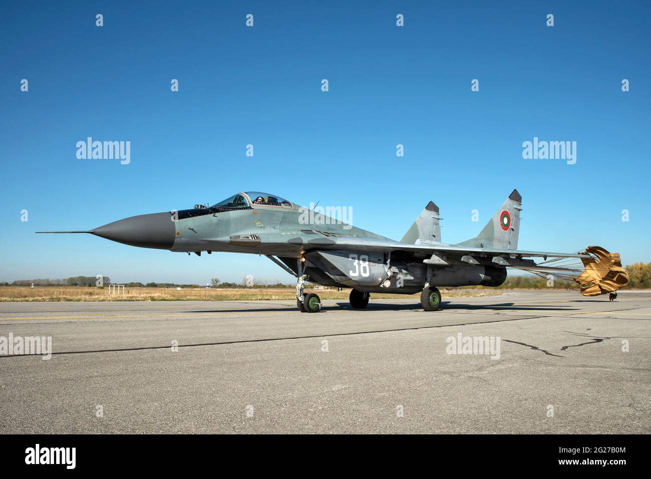 Bulgarian Air Force MiG-29 fighter jet taxiing with brake chute deployed. Stock Photo