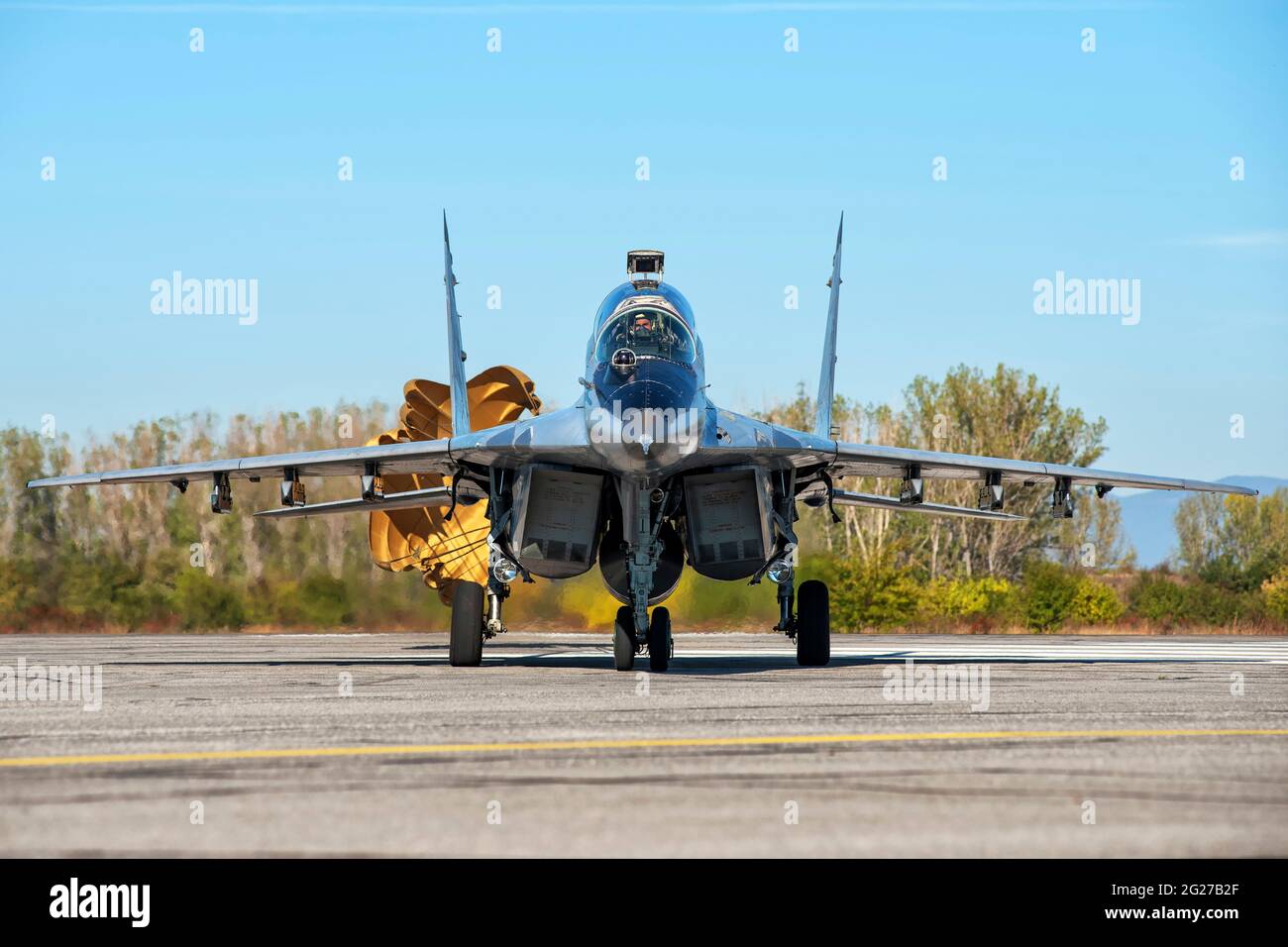 Bulgarian Air Force MiG-29UB fighter jet taxiing with brake chute deployed. Stock Photo