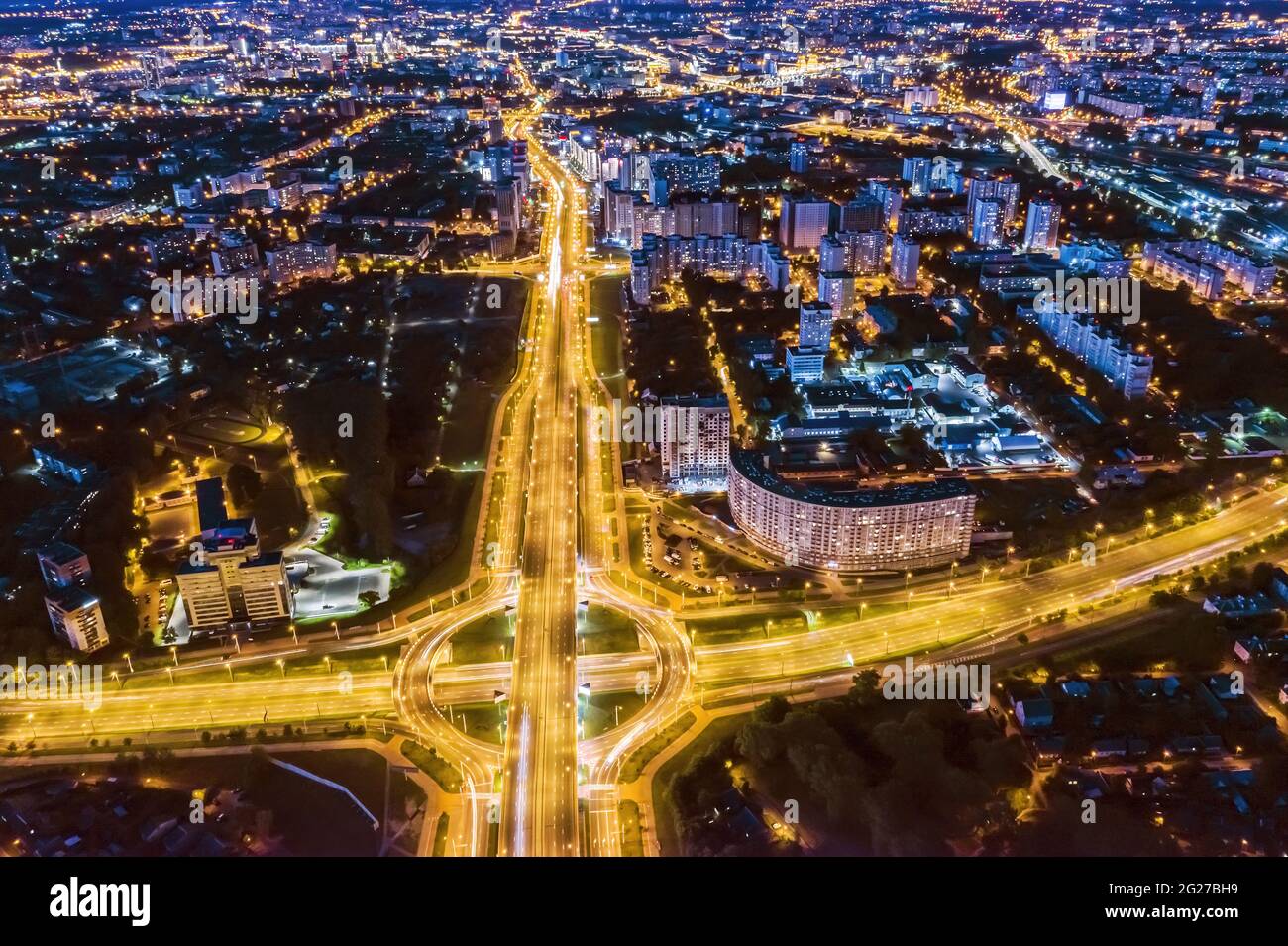 aerial panoramic view of roundabout intersection in residential area at night Stock Photo