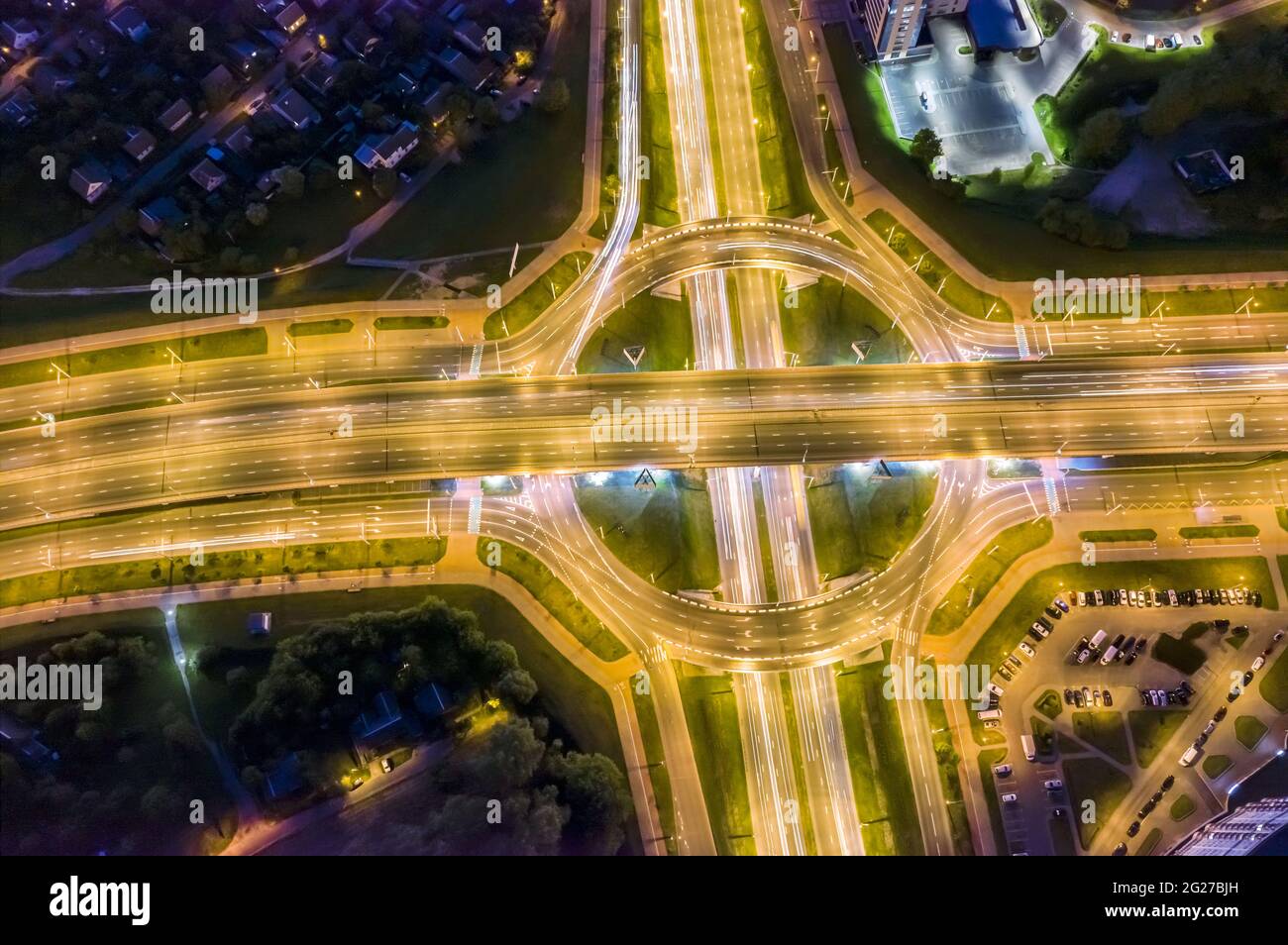 road traffic in night city. aerial view of highway junctions. long exposure Stock Photo