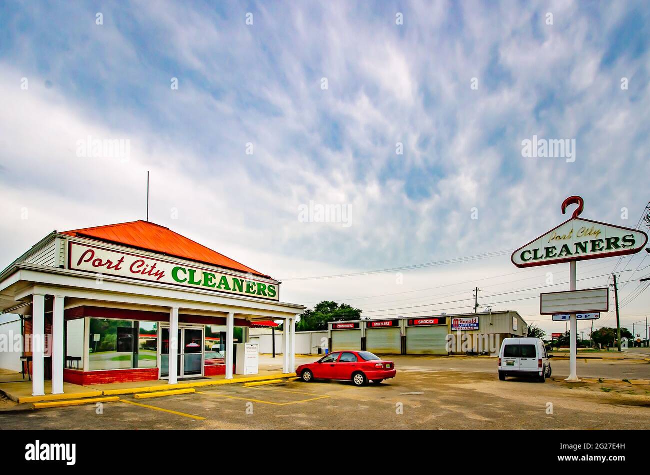 Port City Cleaners and the dry cleaner’s iconic clothes hanger sign are pictured on Highway 90