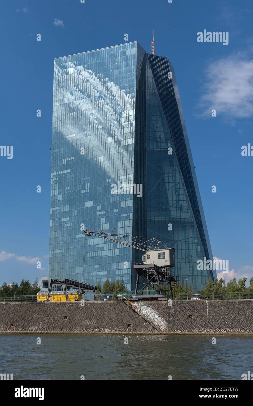 Old harbor crane in front of the building of the European Central Bank, Frankfurt, Germany Stock Photo