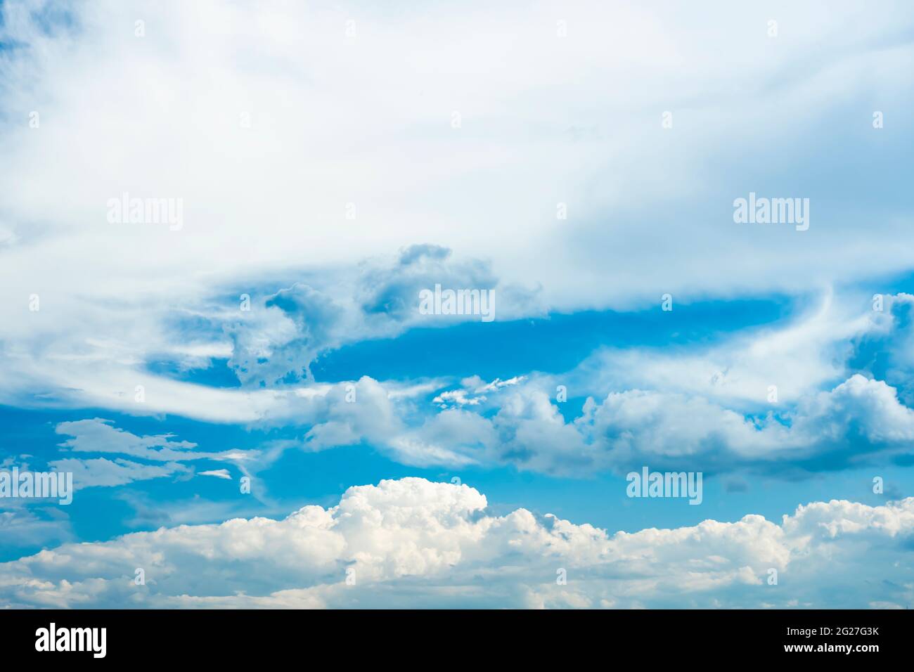 Stunning view of a blue sky with some fluffy clouds. Aerial shoot ...