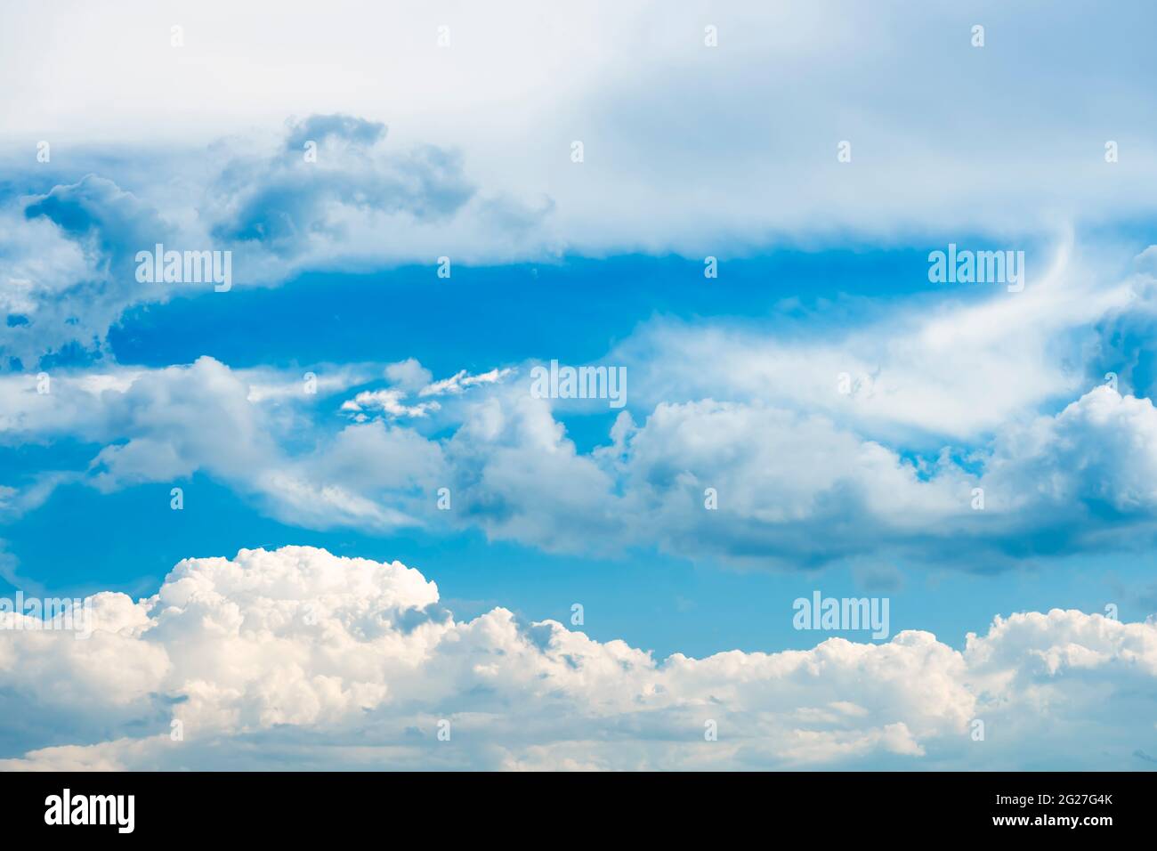 Stunning view of a blue sky with some fluffy clouds. Aerial shoot ...