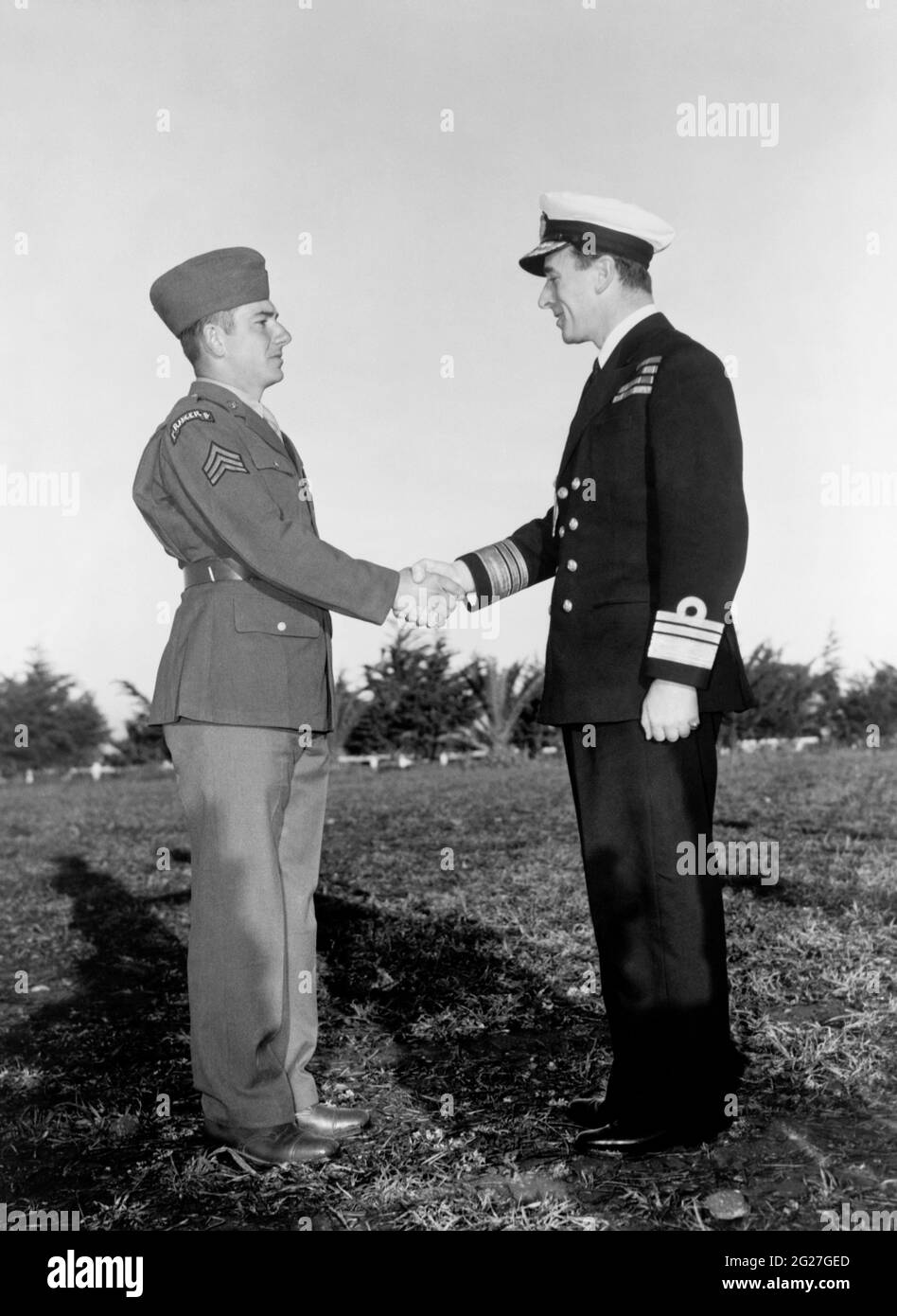 Sergeant Franklin Koons shaking hands with British Vice Admiral Lord Louis Mountbatten. Stock Photo
