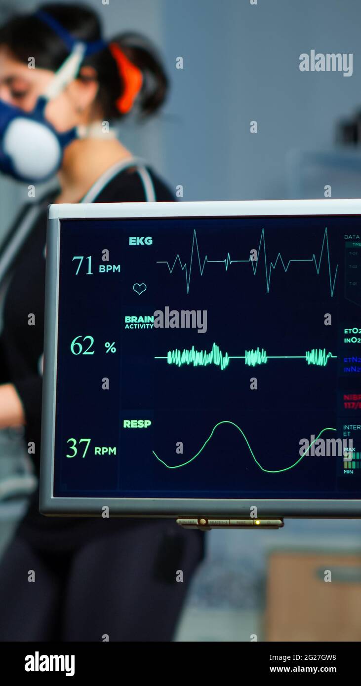 Monitor showing EKG scan of athlete running on cross trainer and