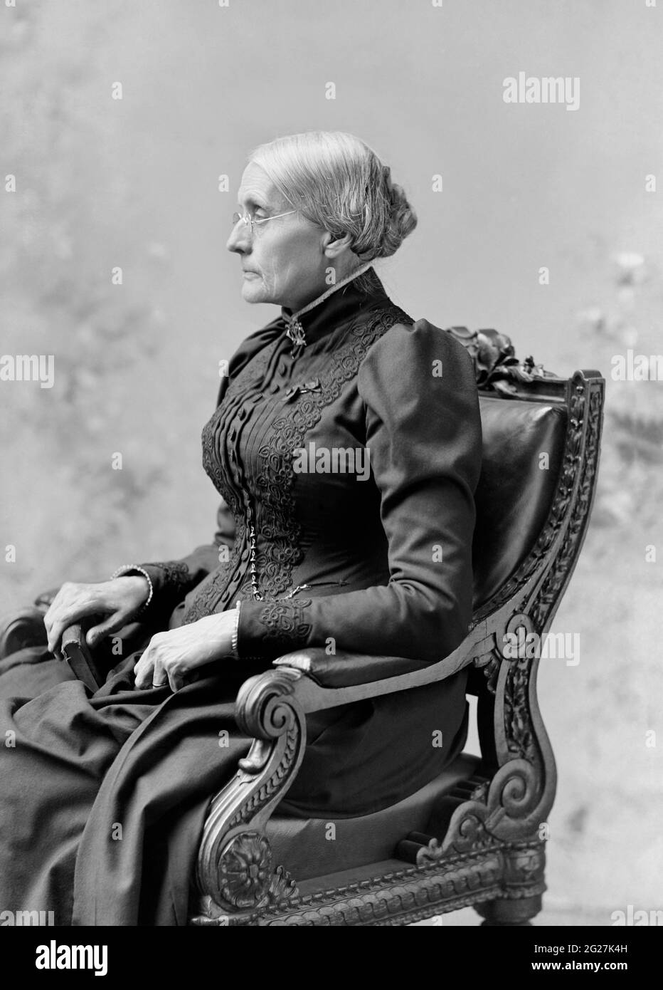 Side portrait of Susan B. Anthony sitting in a chair. Stock Photo