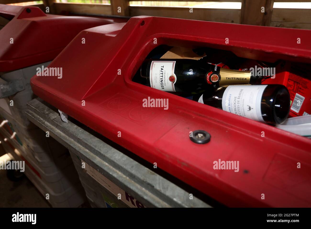 Taittinger Champagne pictured in a council recycling bin in Chichester, West Sussex, UK. Stock Photo