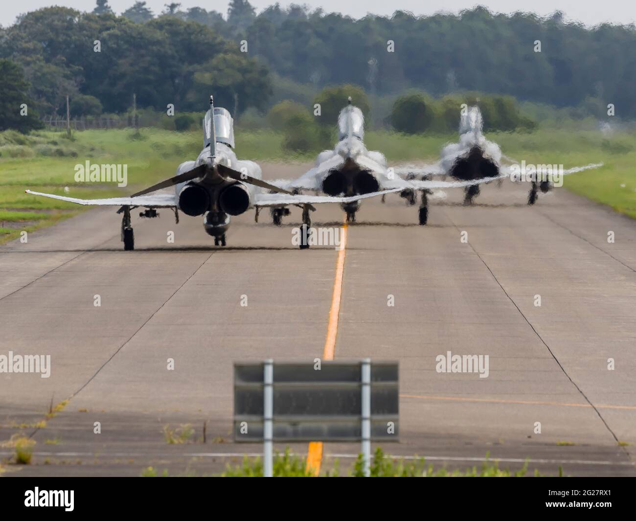 Japan Air Self-Defense Force F-4EJ Phantoms taxi for departure. Stock Photo