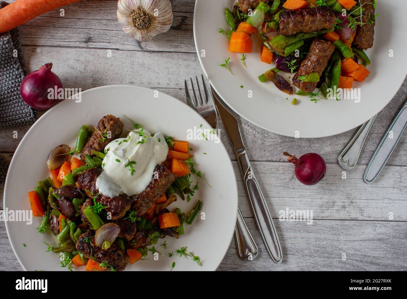 Low carb dish with spicy meat rools and vegetables served with a fresh ...