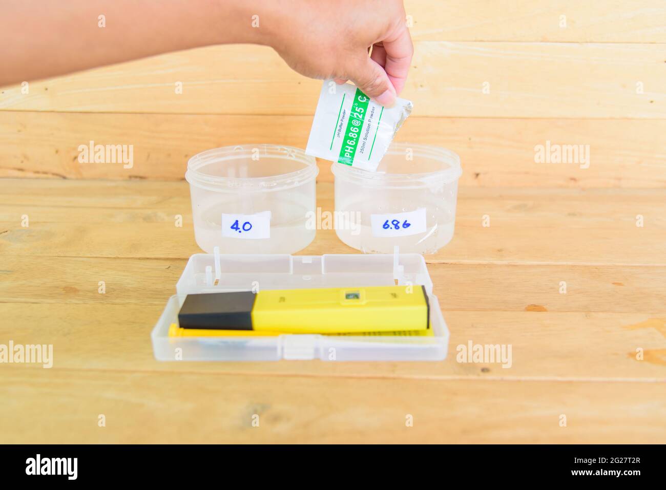 The man calibrate Ph meter before use it for tester Stock Photo Alamy