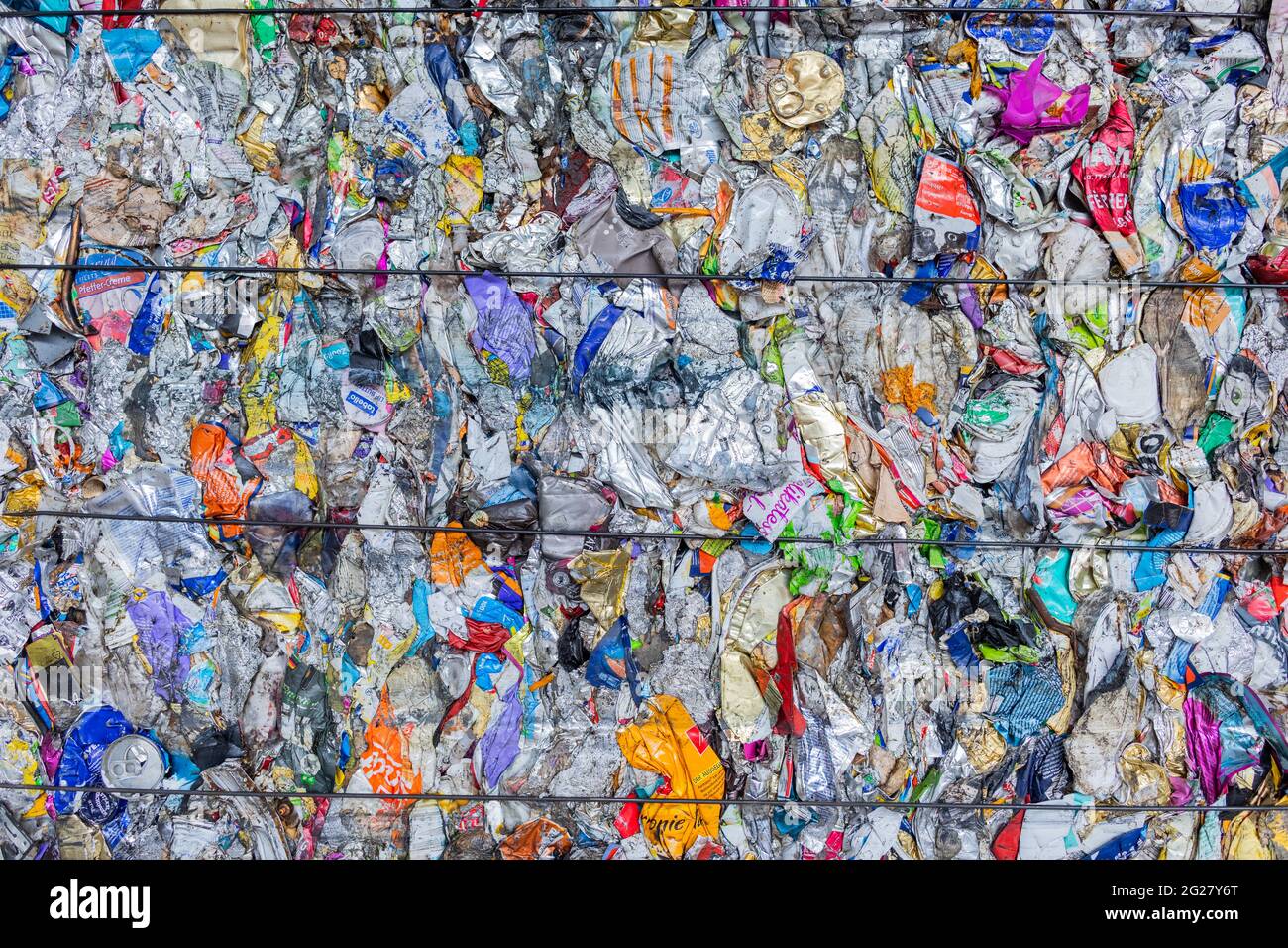 Erftstadt, Germany. 08th June, 2021. Sorted packaging waste stands pressed next to a hall after it has been separated in the sorting plant of the waste disposal company Remondis. Credit: Rolf Vennenbernd/dpa/Alamy Live News Stock Photo