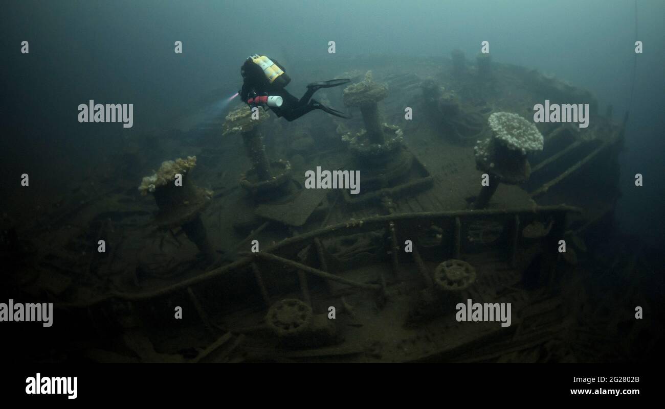 Diver exploring the RMS Justicia shipwreck off Malin Head, Ireland