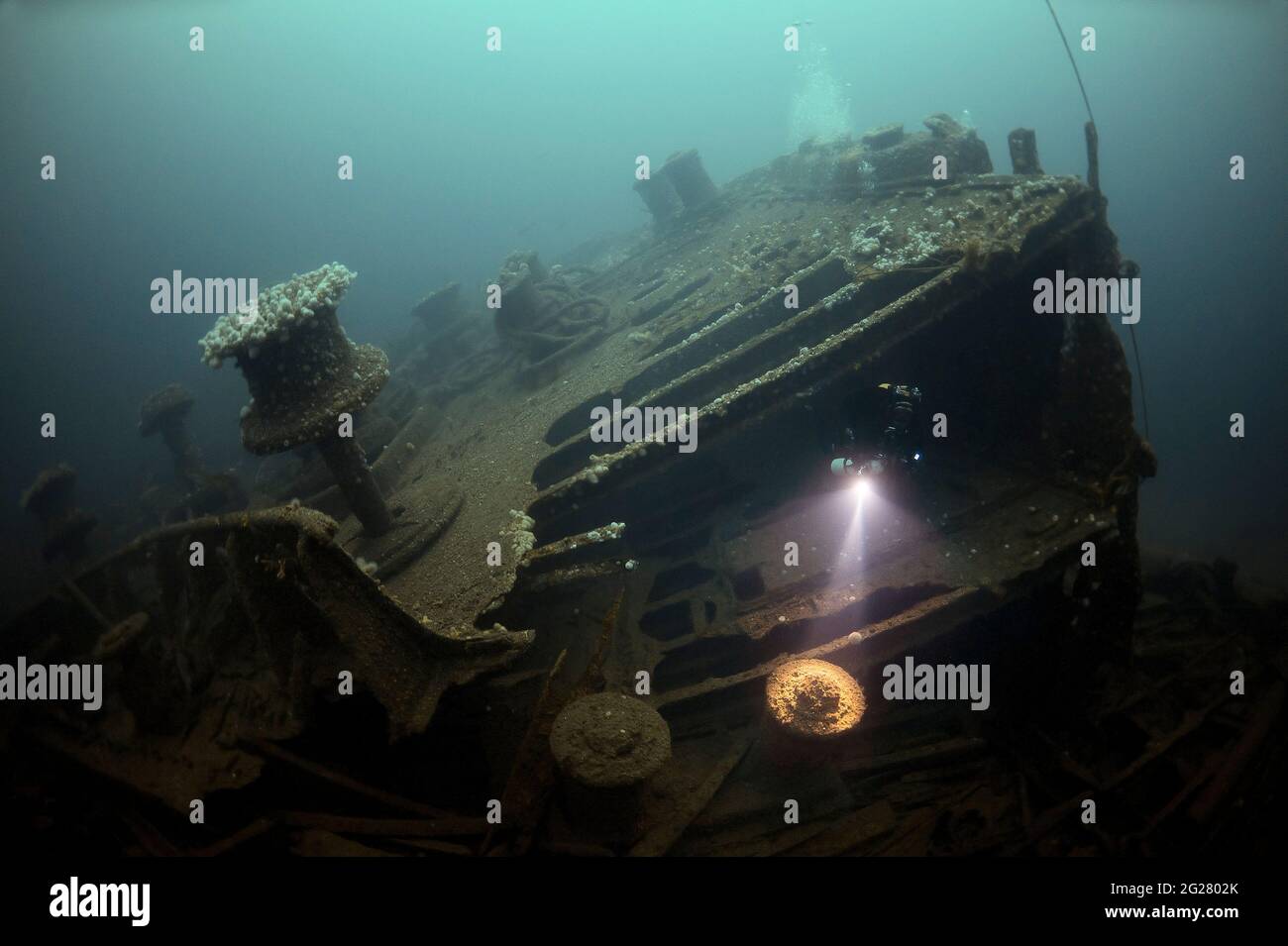 Diver exploring the RMS Justicia shipwreck off Malin Head, Ireland. Stock Photo