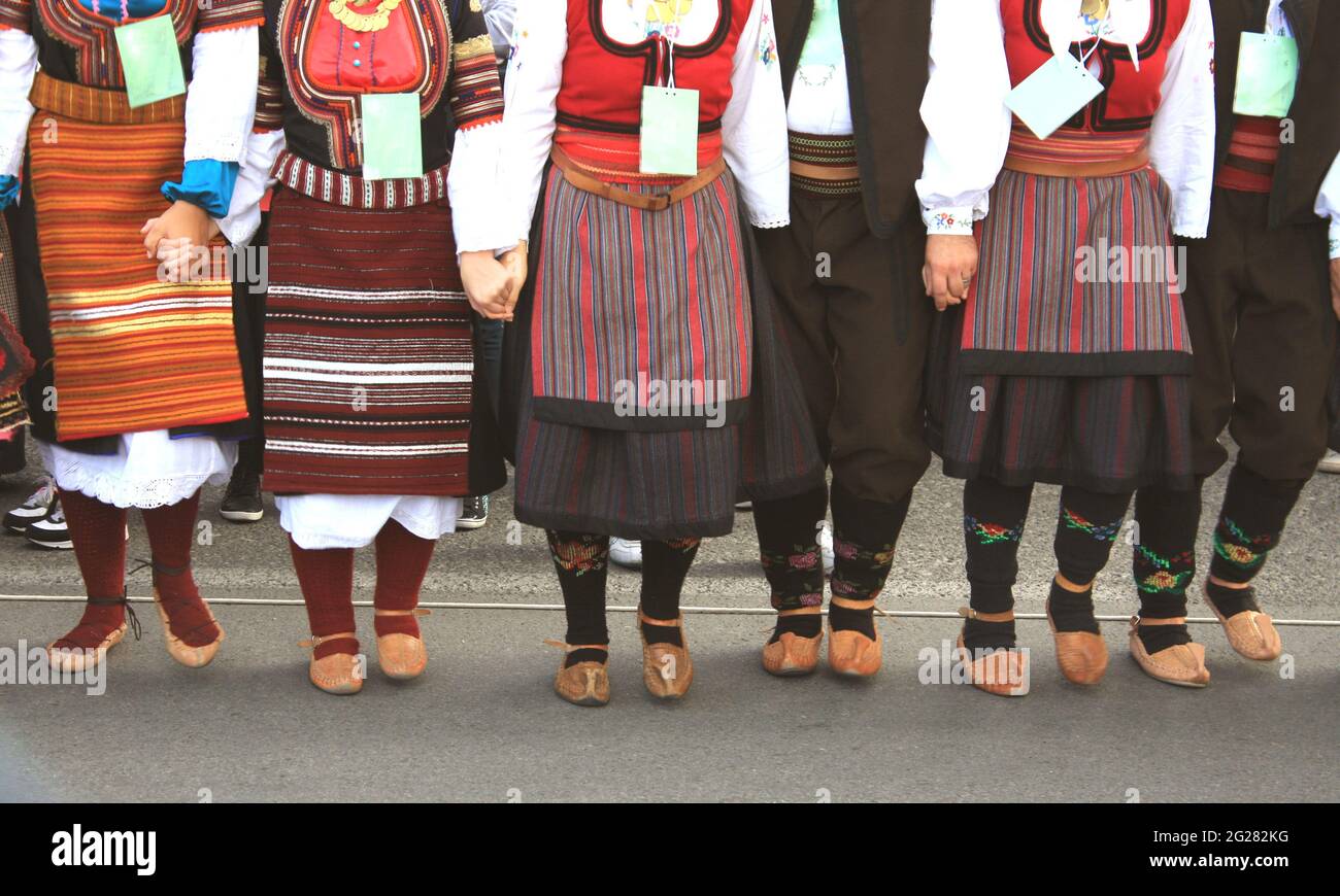 folklore group from Serbia dressed in traditional clothing is preforming Serbian national dances. Stock Photo