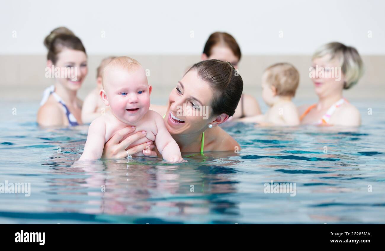Group of mums with their baby children at infant swimming class Stock Photo Alamy