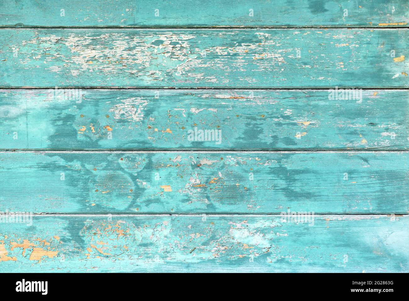 Background with wooden teal blue colored old weathered planks with chipped paint Stock Photo