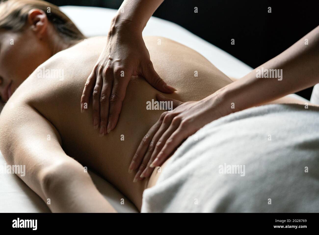 Healthy woman having massage therapy at spa salon Stock Photo