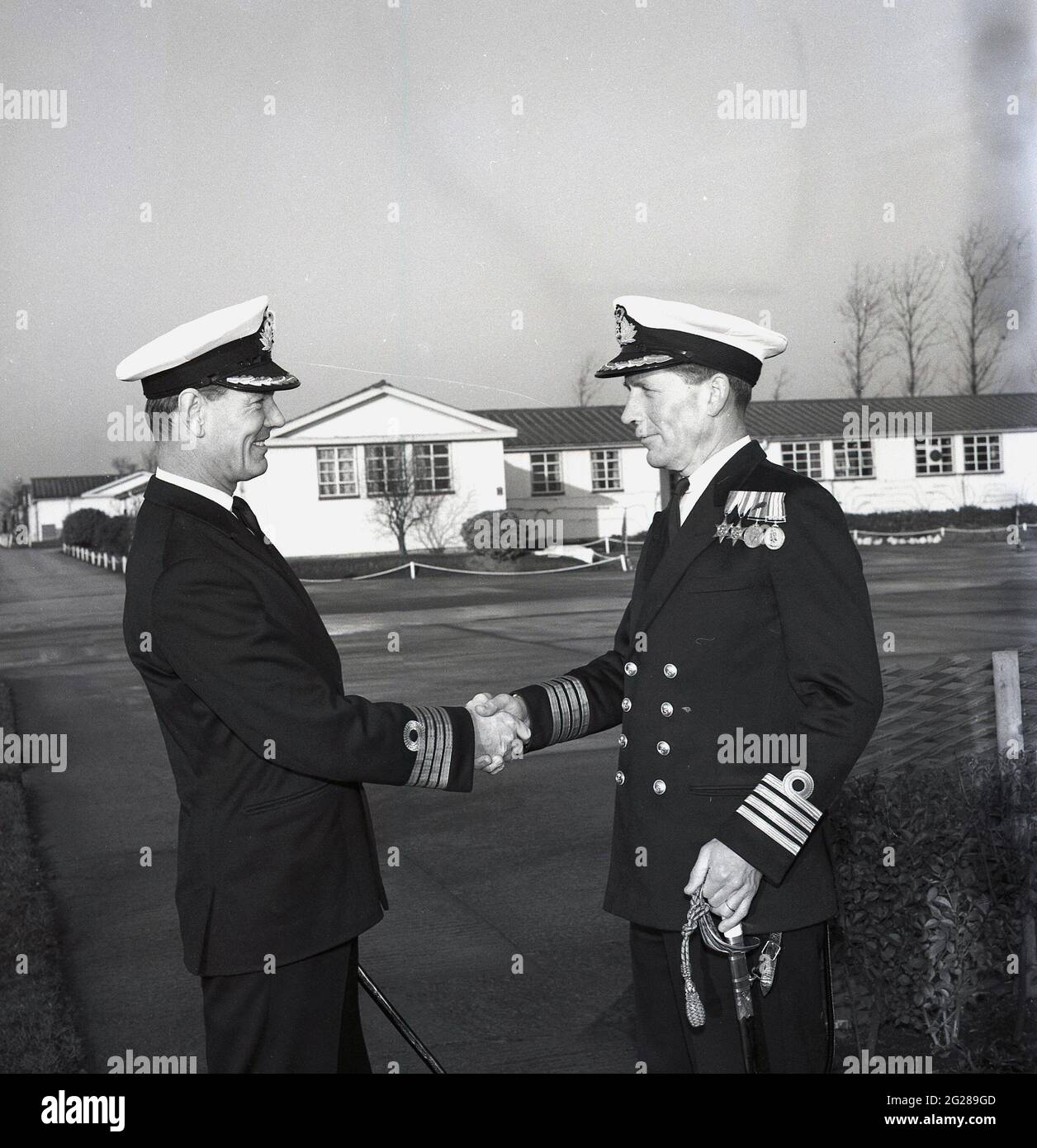 1960s, historical, outside at a military base, two Royal Naval Captains