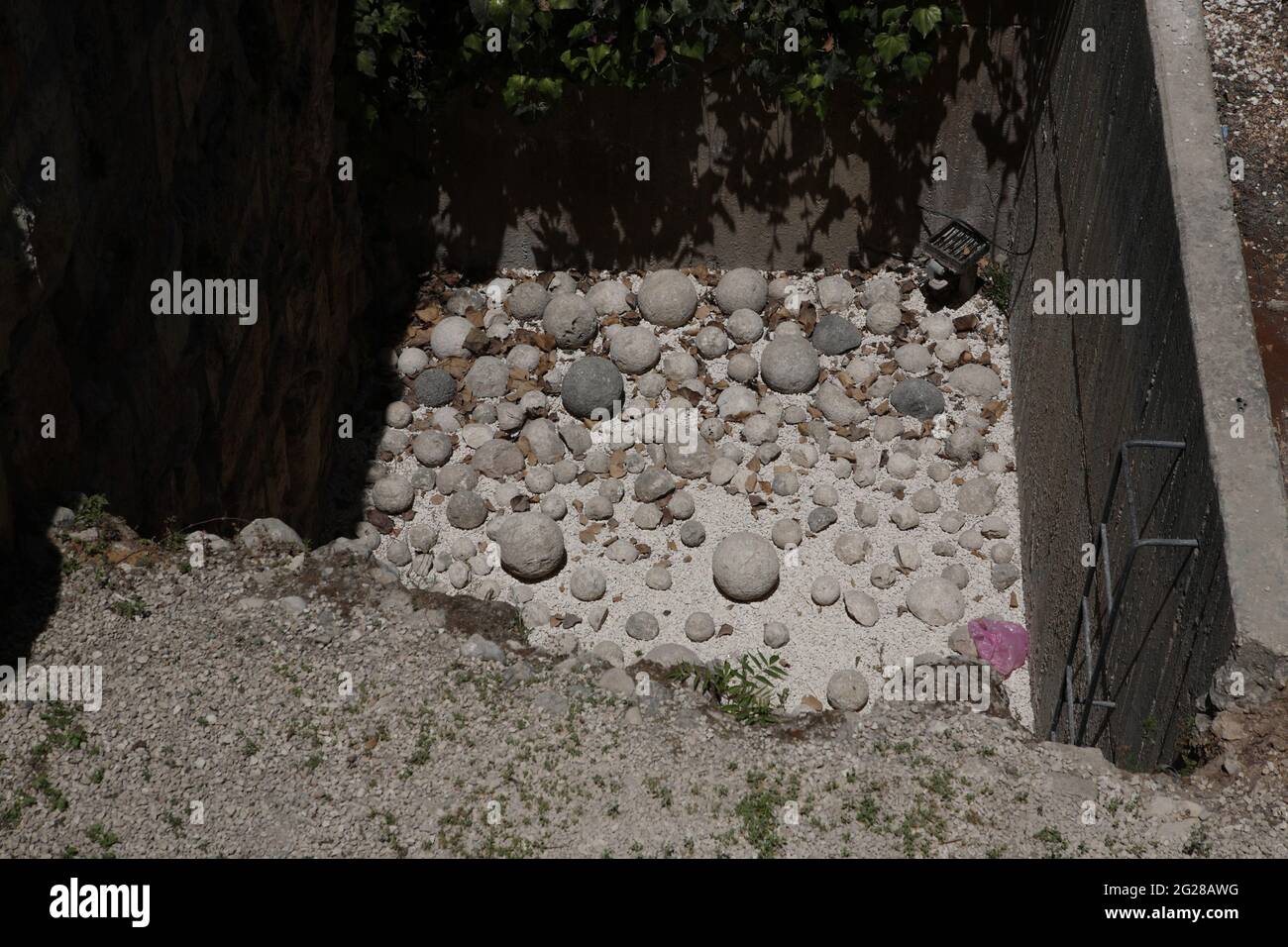 Catapult stones in the excavated area in David's Citadel, they were hurled with ballista by Greek Seleucids to pound the wall of Hasmonean Jerusalem. Stock Photo