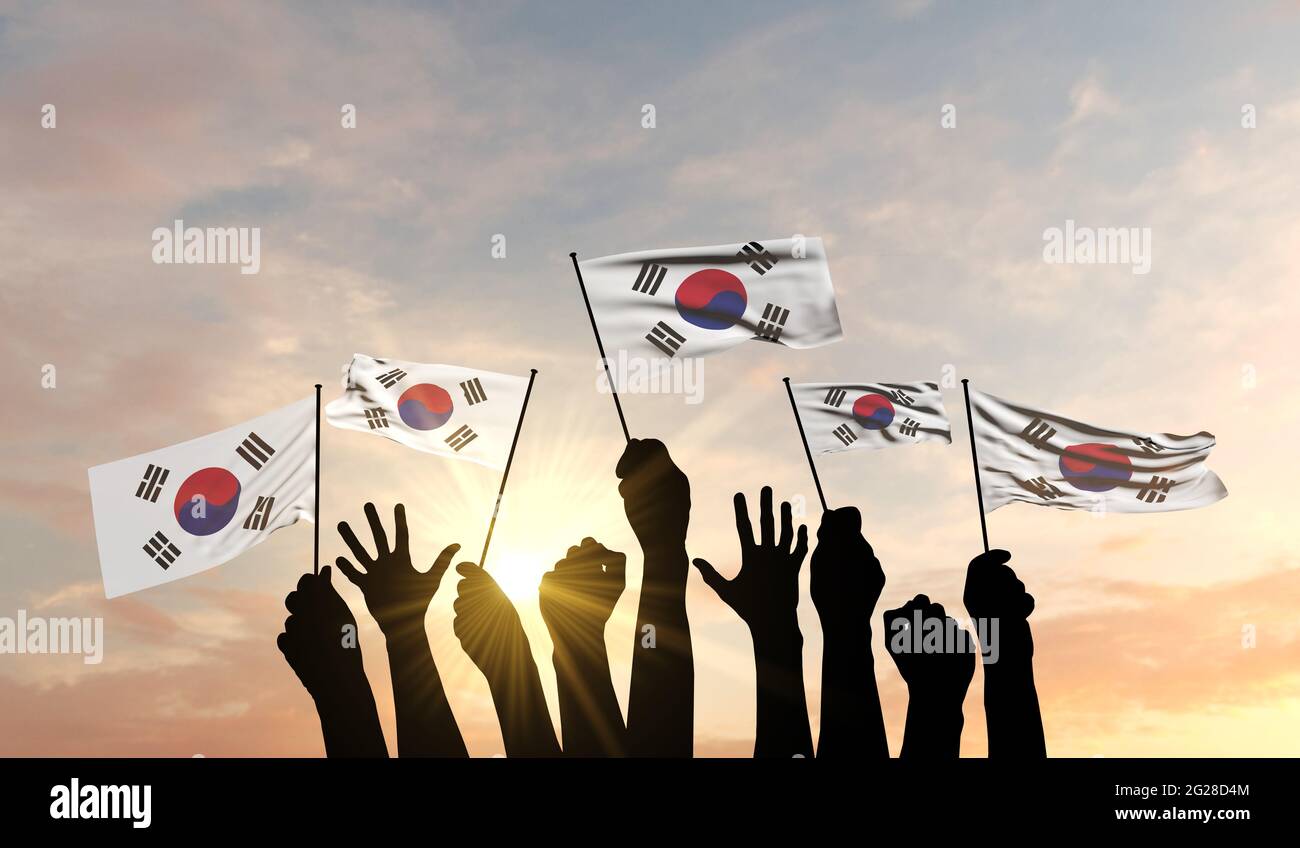 Silhouette of arms raised waving a South Korea flag with pride. 3D Rendering Stock Photo