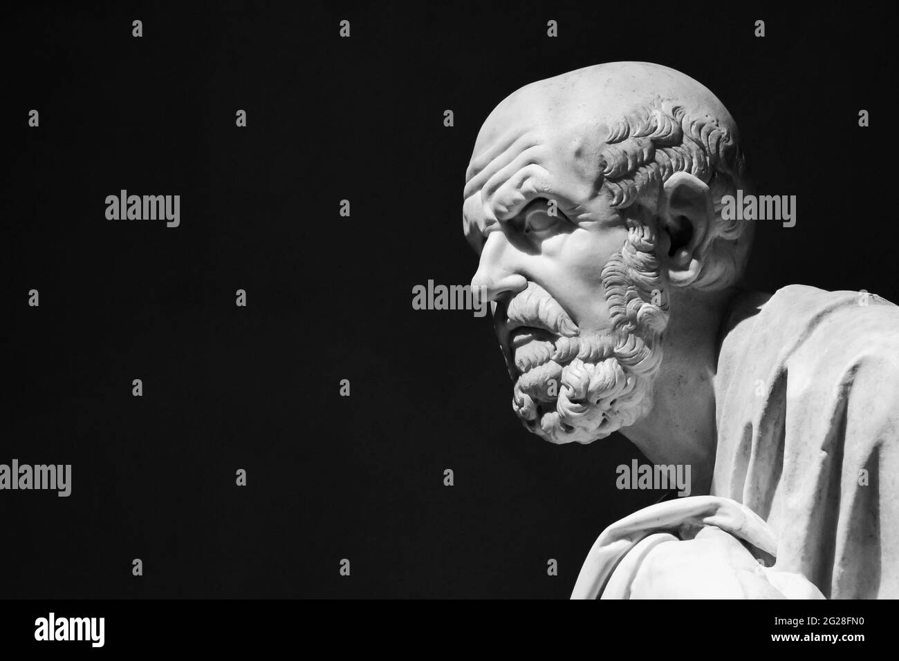 Black and white photo of ancient roman statue representing a senior man in profile Stock Photo