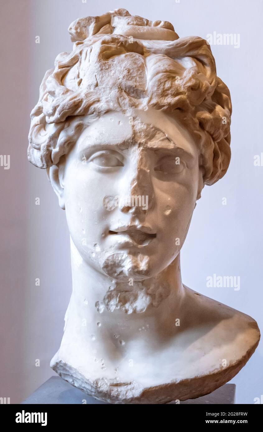 Close-up on beautiful female head of ancient marble statue in ruins Stock Photo