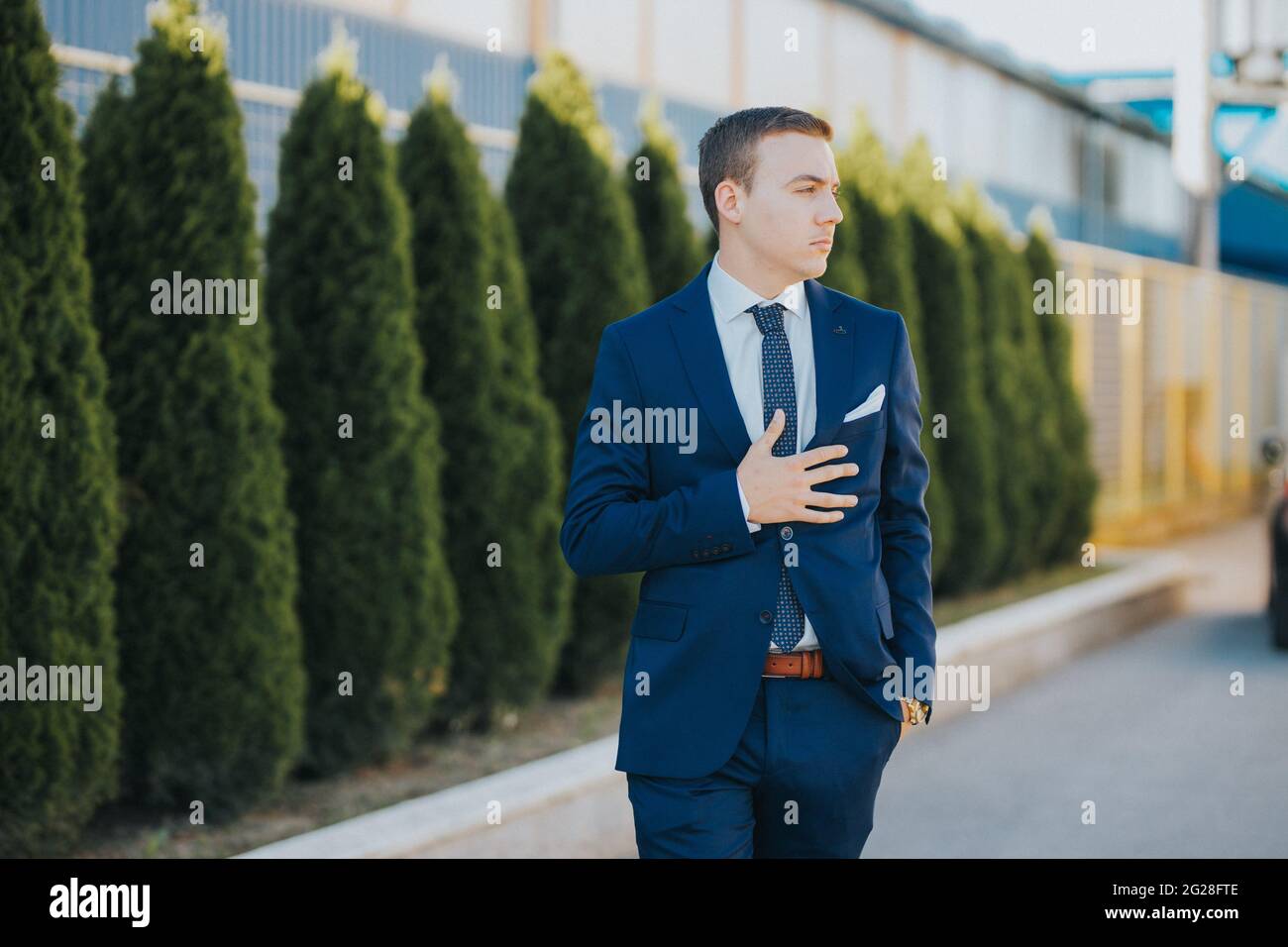 Caucasian young businessman in suit and tie standing outdoor Stock ...