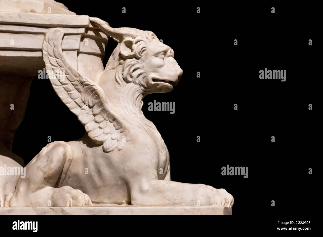 Close-up on griffin statue supporting the base of ancient roman monument Stock Photo