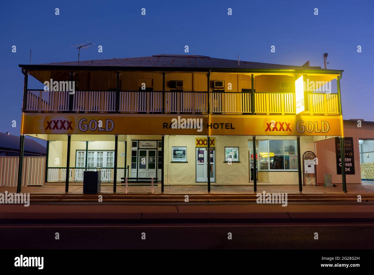 Typical old country pub hotel with a verandah and corrugated iron walls in Barcaldine, Queensland, Australia against an evening sky. Stock Photo