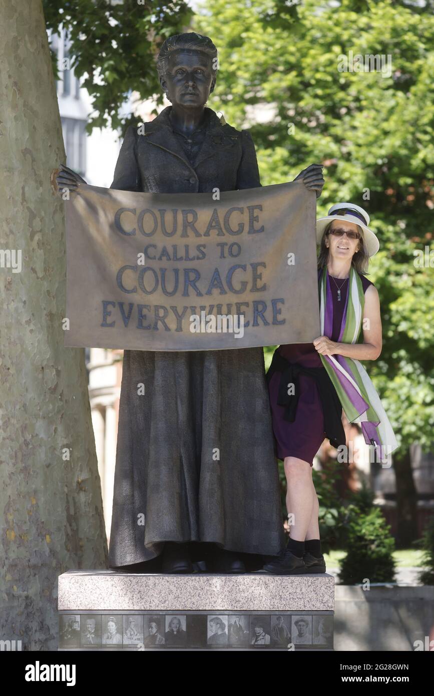 London, UK. 9th June, 2021. Helen Pankhurst, Great Grand-daughter of Emmeline Pankhurst, poses by the statue of Millicent Fawcett. Charities, celebrities, activists and MPs protest in Westminster asking the Government and Boris Johnson to consider women's rights ahead of the G7 summit from 11th-13th June. MPs such as Jess Philips, Marsha De Cordova and Baroness Suggs gathered at the Millicent Fawcett statue in Parliament Square to walk to Downing Street. Helen Pankhurst, Great Grand-daughter of Emmeline Pankhurst, posed by the statue of Millicent Fawcett. Credit: Mark Thomas/Alamy Live News Stock Photo