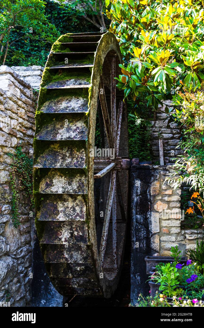 Water mill. The wheel of the water mill. The mill is a river. Stock Photo