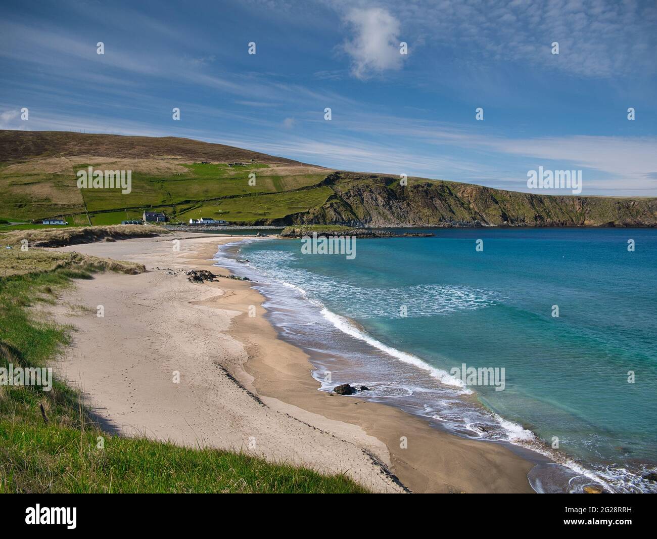 With sunshine on turquoise water, the pristine, deserted Norwick beach on the island of Unst, Shetland, UK Stock Photo