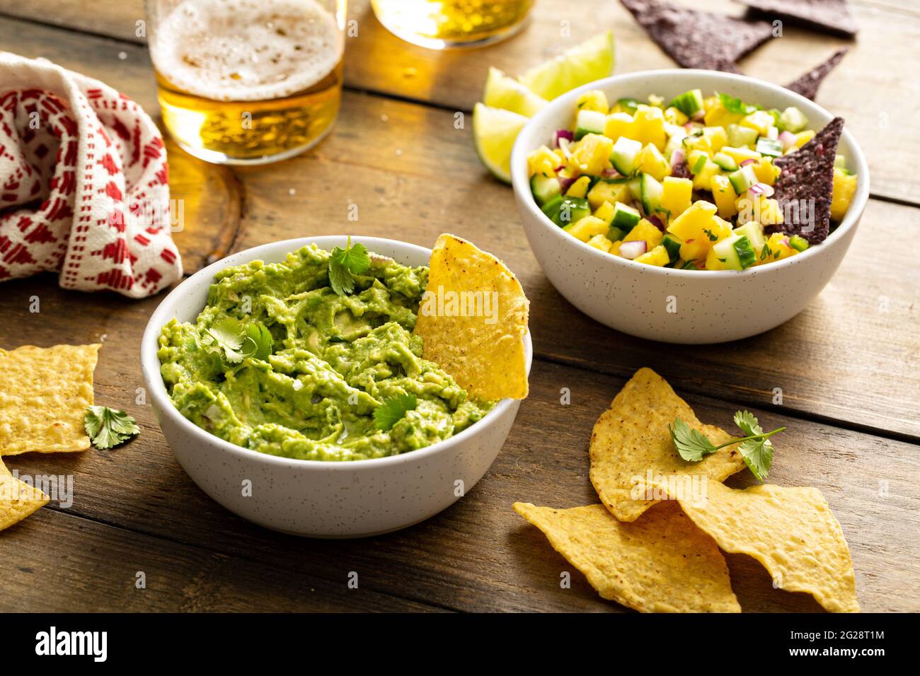 Tortilla chips with dips, guacamole and salsa Stock Photo