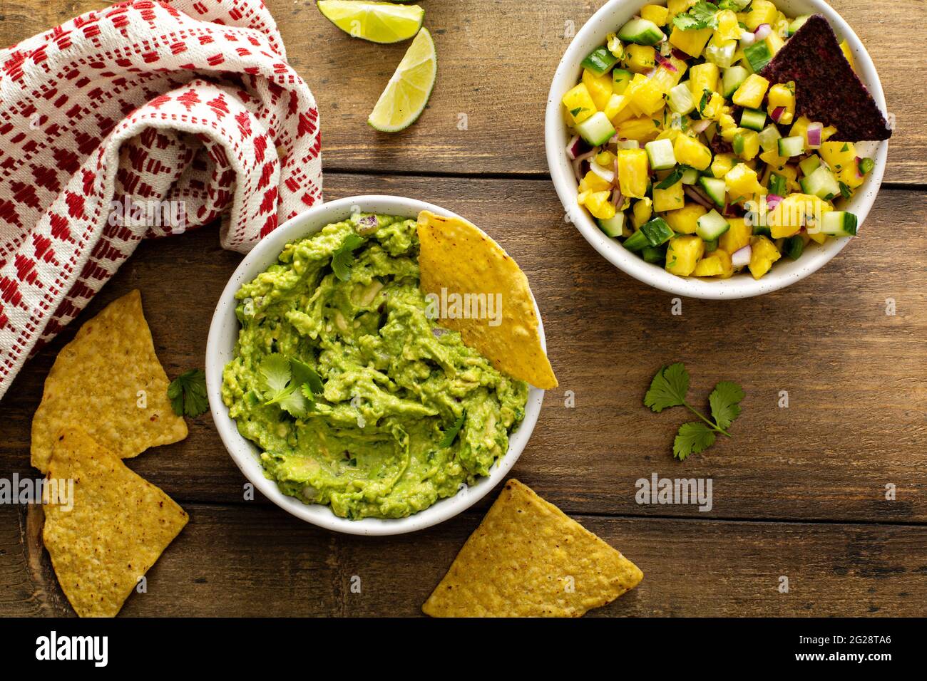 Tortilla chips with dips, guacamole and salsa Stock Photo Alamy