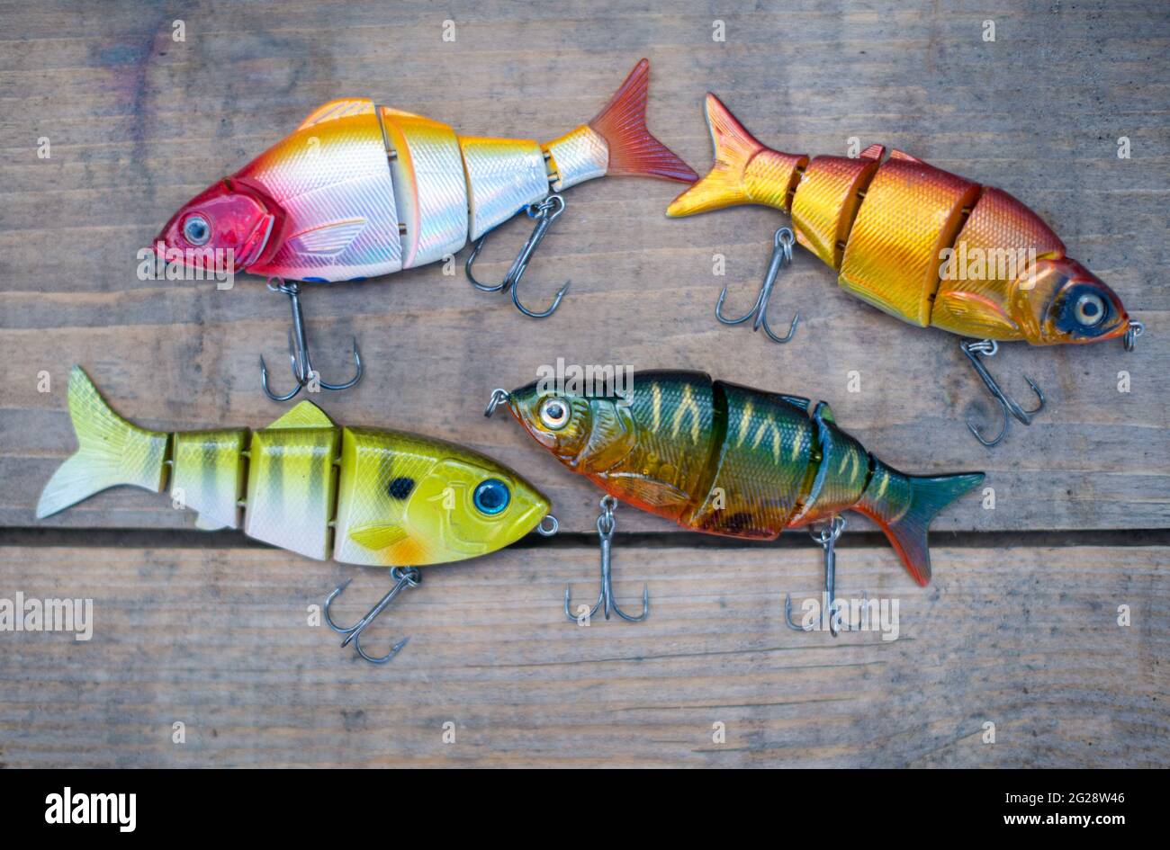 Fishing lures and tackle in the form of bright fish. Sets of accessories for fishing. Stock Photo