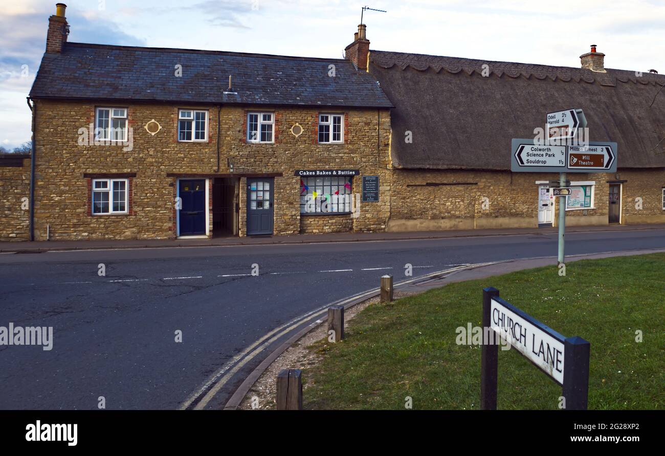 Shops and cottages on village green in Sharnbrook, Bedfordhire, England, UK Stock Photo