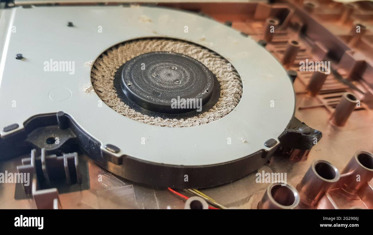 Closeup on a laptop cooler. Maintenance and prevention of the laptop  cooling system. Electronic device repair concept. Dust and dirt on the  computer f Stock Photo - Alamy