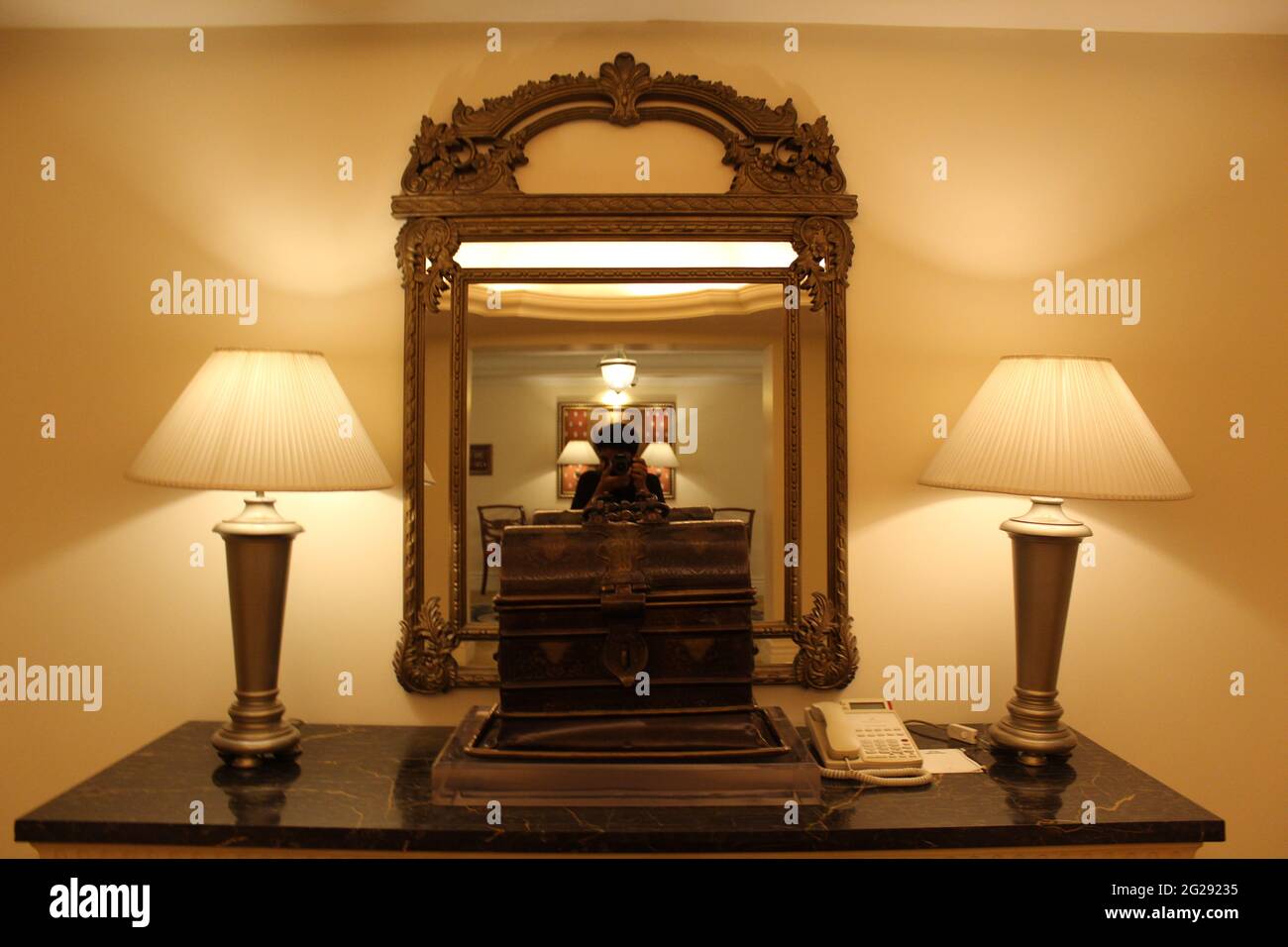 Mirror and Lamps with Luxury Design and Ancient Chest Stock Photo