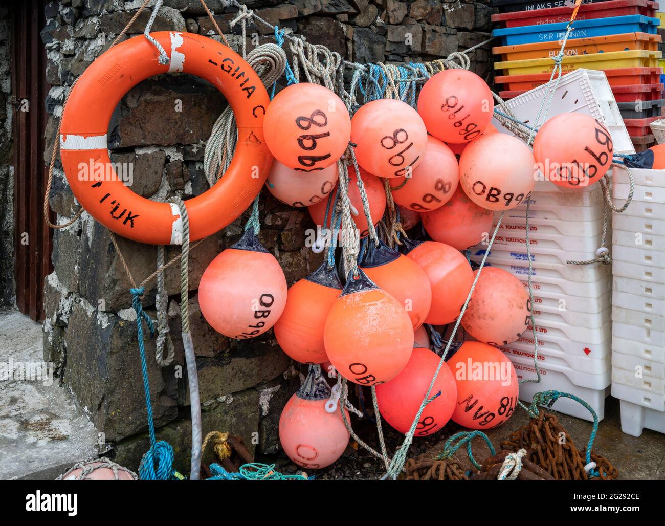 A colourful selection of buoys and fishing tackle at Croig harbour on the Isle of Mull Stock Photo