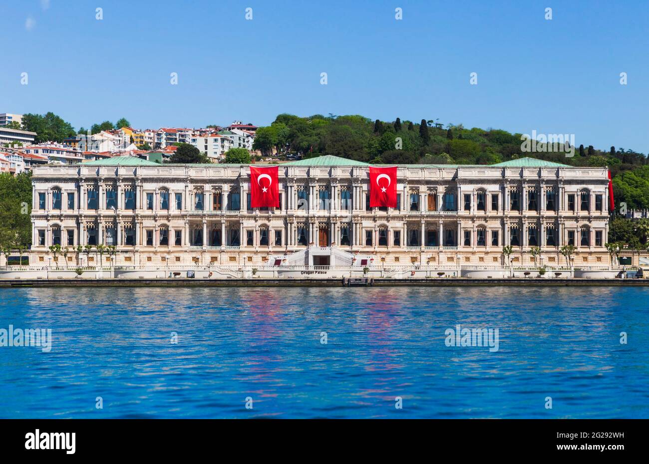 Ortakoy, Istanbul, Turkey May 19th, 2021: Ciragan Palace Kempinski Hotel at Ortakoy, Istanbul, decorated by Turkish flags  due to Youth and Sports Nat Stock Photo