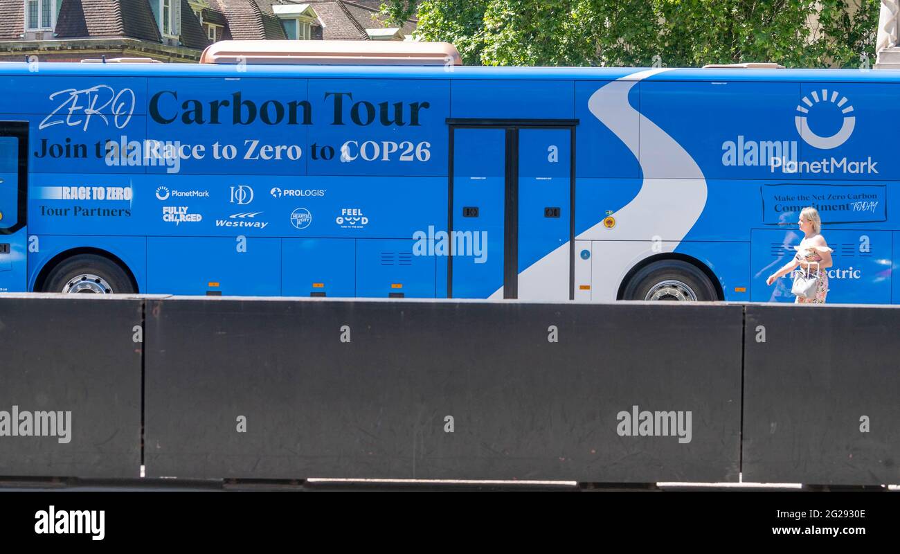 London, UK. 9th June, 2021. Fully carbon neutral battle bus outside the houses of Parliament as part of the zero carbon tour UK in support of the UN-backed Race to Zero campaign. This is the world's largest alliance of actors committed to halving global emissions by 2030 and achieving net zero emissions by 2050 at the latest. Credit: Ian Davidson/Alamy Live News Stock Photo