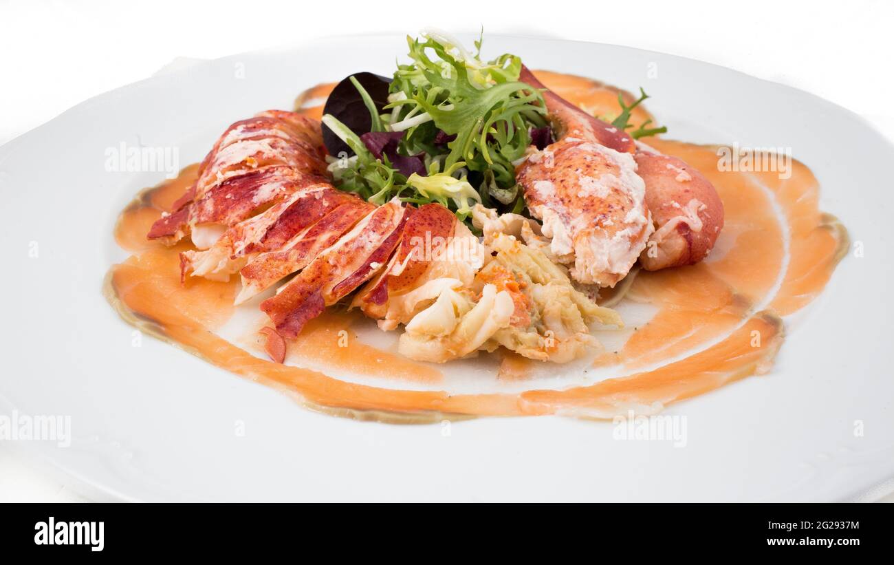 Lobster plate with pink sauce and lettuce Stock Photo